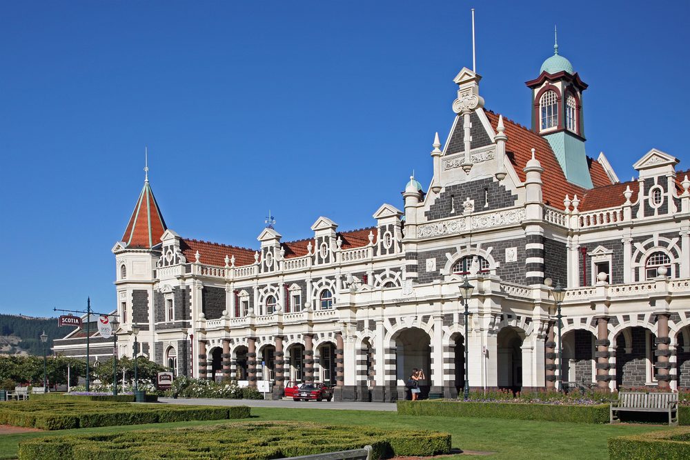 The Flemish Renaissance facade of Dunedin Railway Station with its gardens in the foreground